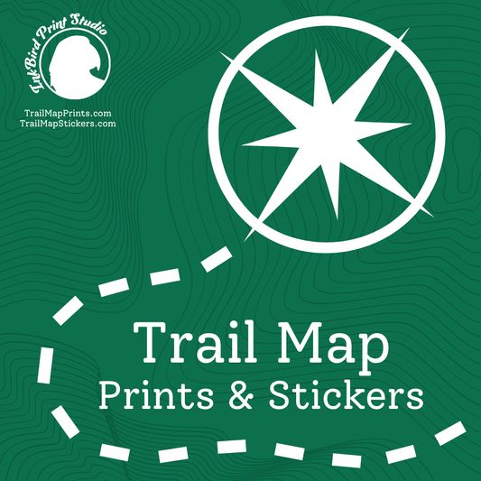 A green graphic with topographic contour lines, a white compass rose icon, and the text 'Trail Map Prints & Stickers.' A circular 'Art Bird Print Studio' logo appears in the upper left, and a dashed white line traces part of the design.