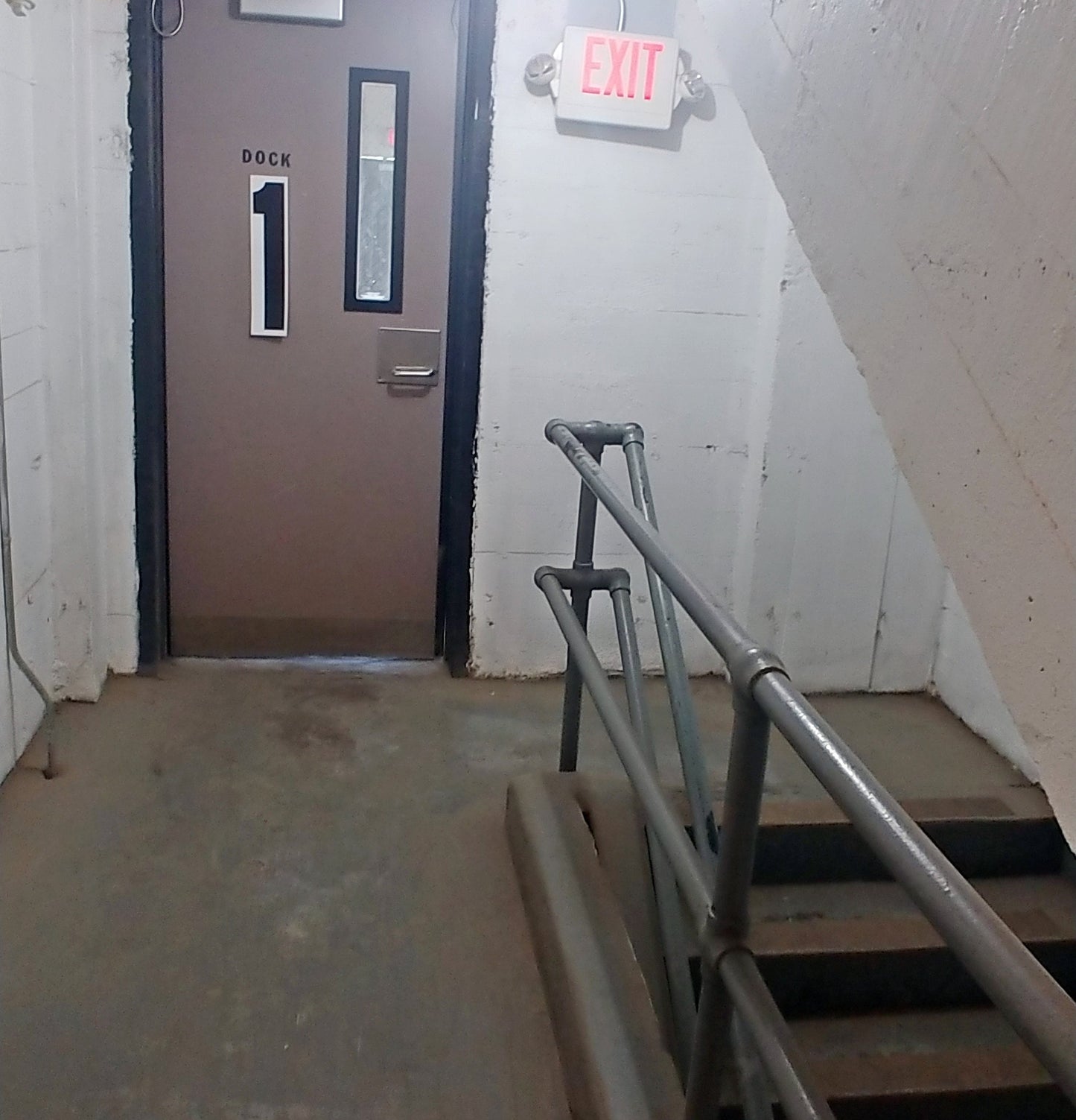 the number 1 printed as an 18 inch tall decal from the Stikons line by InkBird Print Studio, applied to a door indicating you are on floor 1.