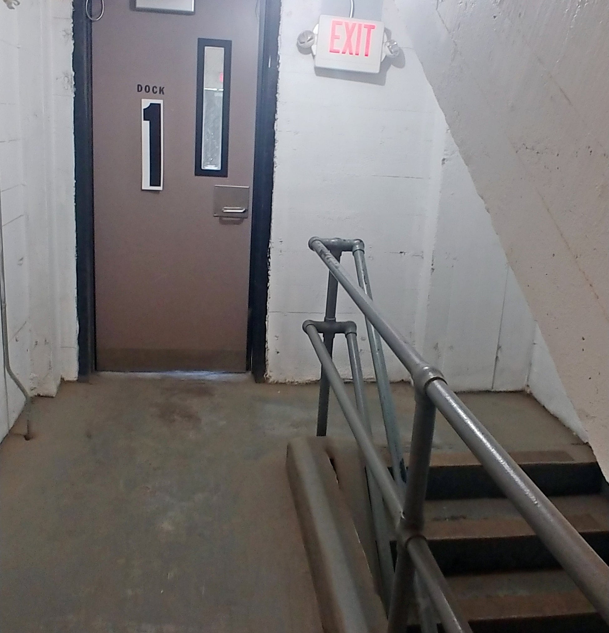 the number 1 printed as an 18 inch tall decal from the Stikons line by InkBird Print Studio, applied to a door indicating you are on floor 1.