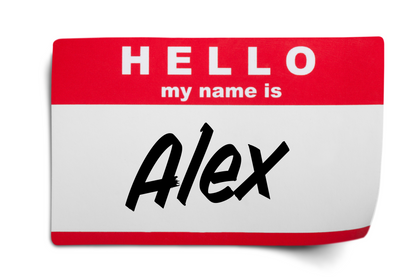 A custom name tag styled like a classic red and white 'Hello my name is' badge, with the name 'Alex' written in black script on a white background.