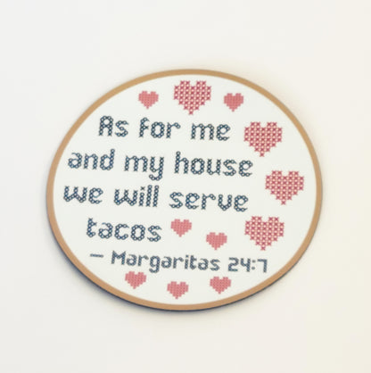 The Cross Stitch Design Fridge Magnet by InkBird Print Studio LLC, featuring the playful text "As for me and my house, we will serve tacos. Margaritas 24:7," is adorned with red hearts on a white background. This charming piece is an ideal housewarming gift that brings both humor and warmth to any home.