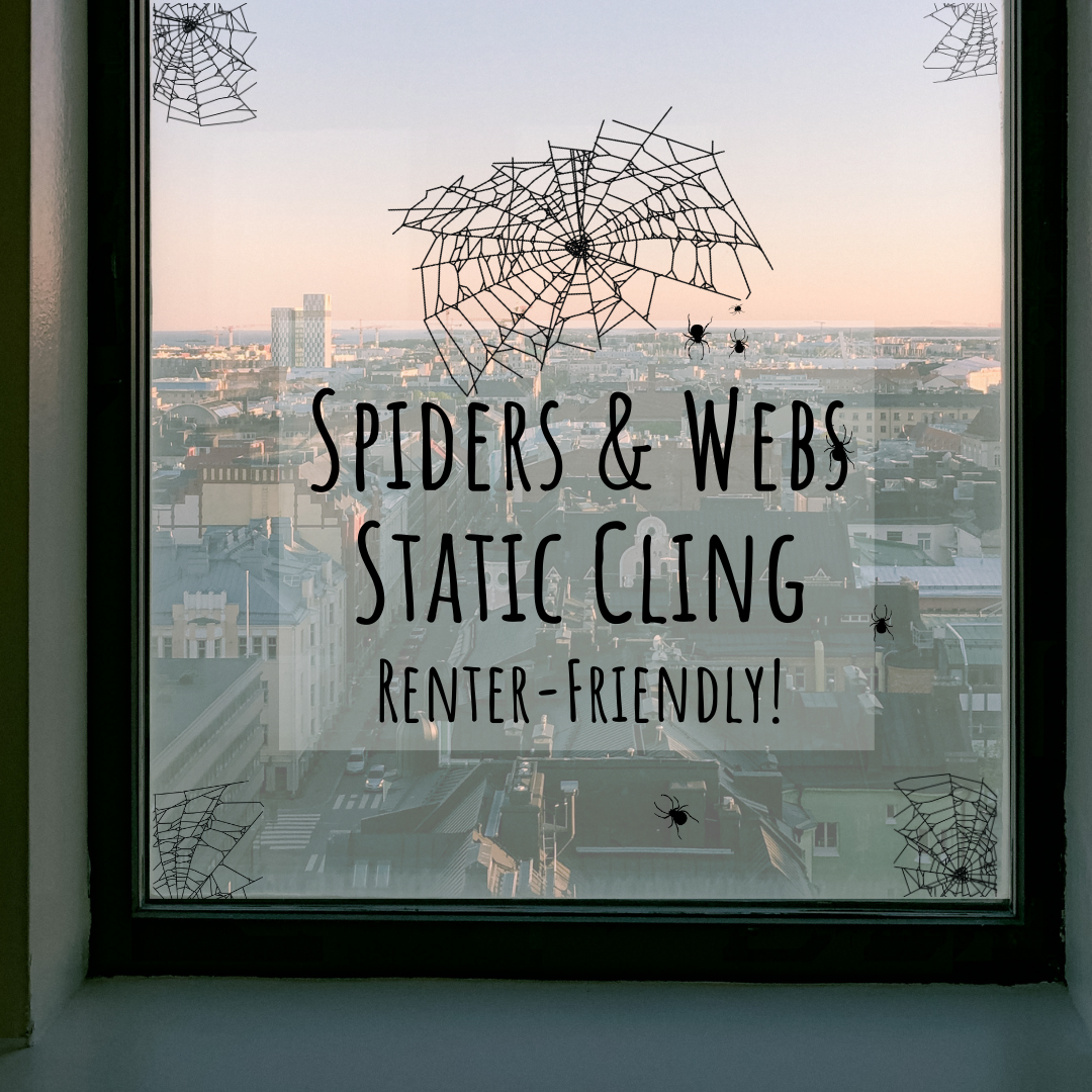 Spider webs static clings for Halloween window decor shown on a window with a cityscape in the background. These are renter-friendly, screen-printed and contour-cut, perfect for glass surfaces, creating a spooky Halloween atmosphere, made in-house at Inkbird Print Studio.