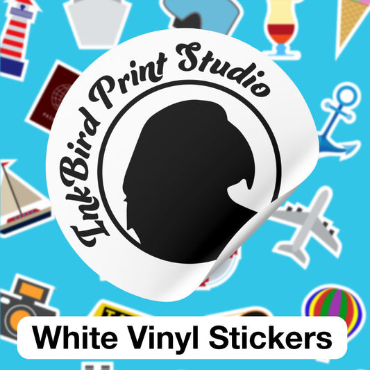 A white vinyl sticker shown on a bright blue background with scattered sticker-style icons. The main sticker is circular and partially peeled at the bottom right, featuring a black silhouette profile and the text 'InkBird Print Studio.