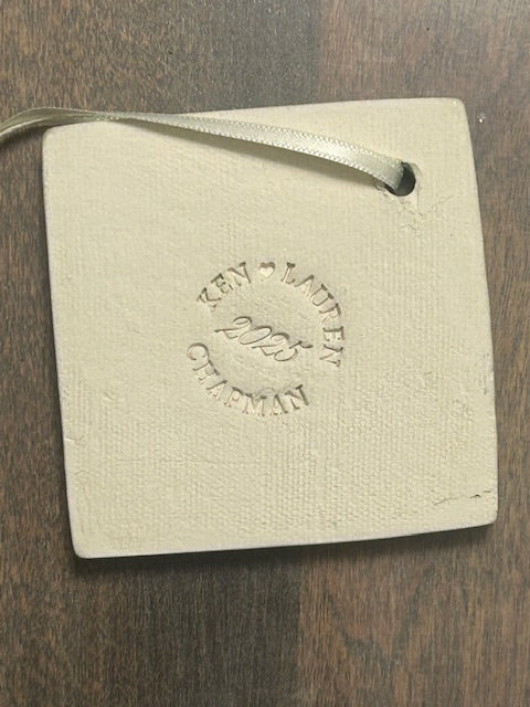 Square off-white clay ornament, gold ribbon, circular text, showing the results of a custom Pottery Makers Mark Stamp by InkBird Print Studio, stamped into the back of a tile.