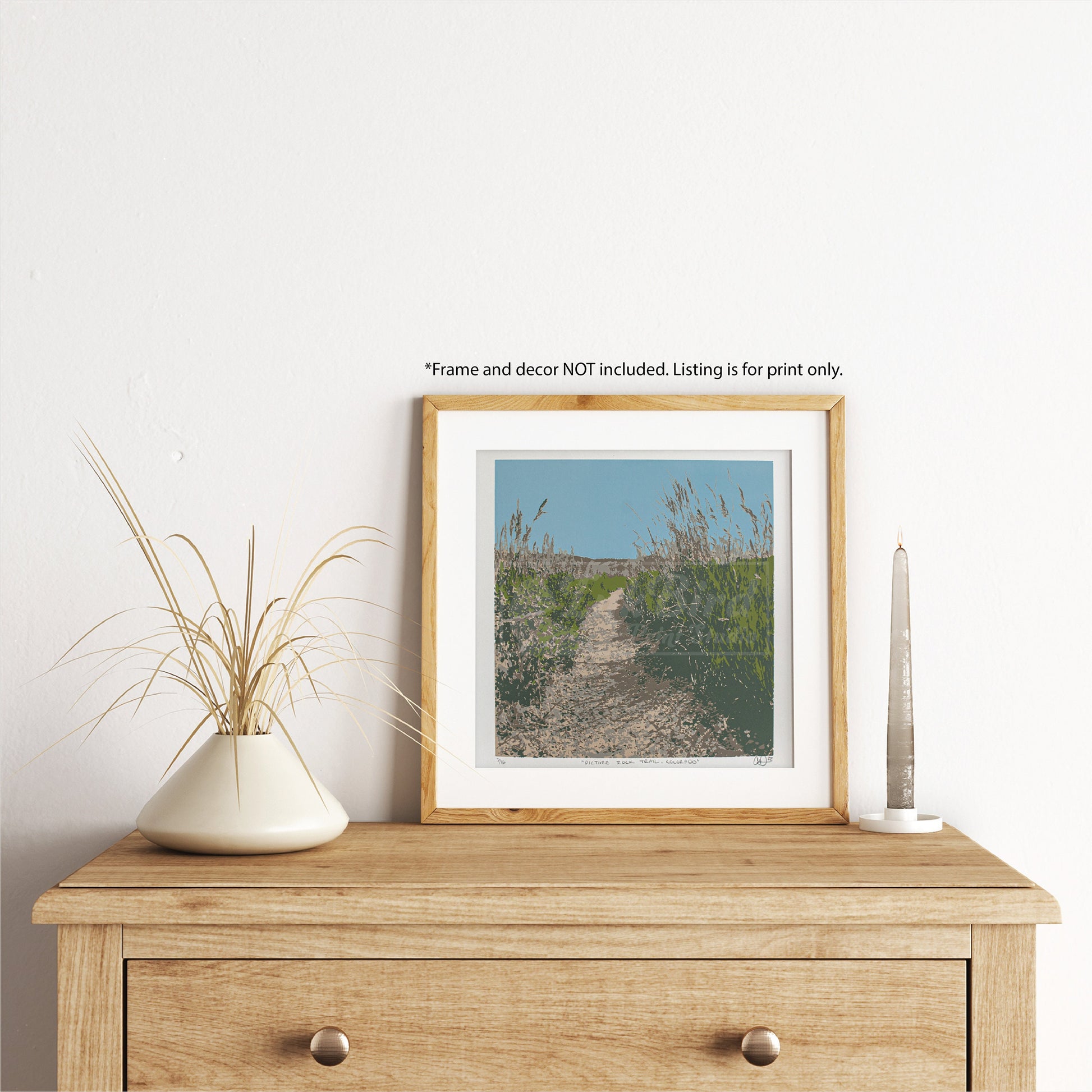 A wooden dresser showcases this hand-pulled, six-color screen print from InkBird Print Studio LLC, titled "Picture Rock Trail".   
Please note that text above the frame mentions it is not included in the listing.