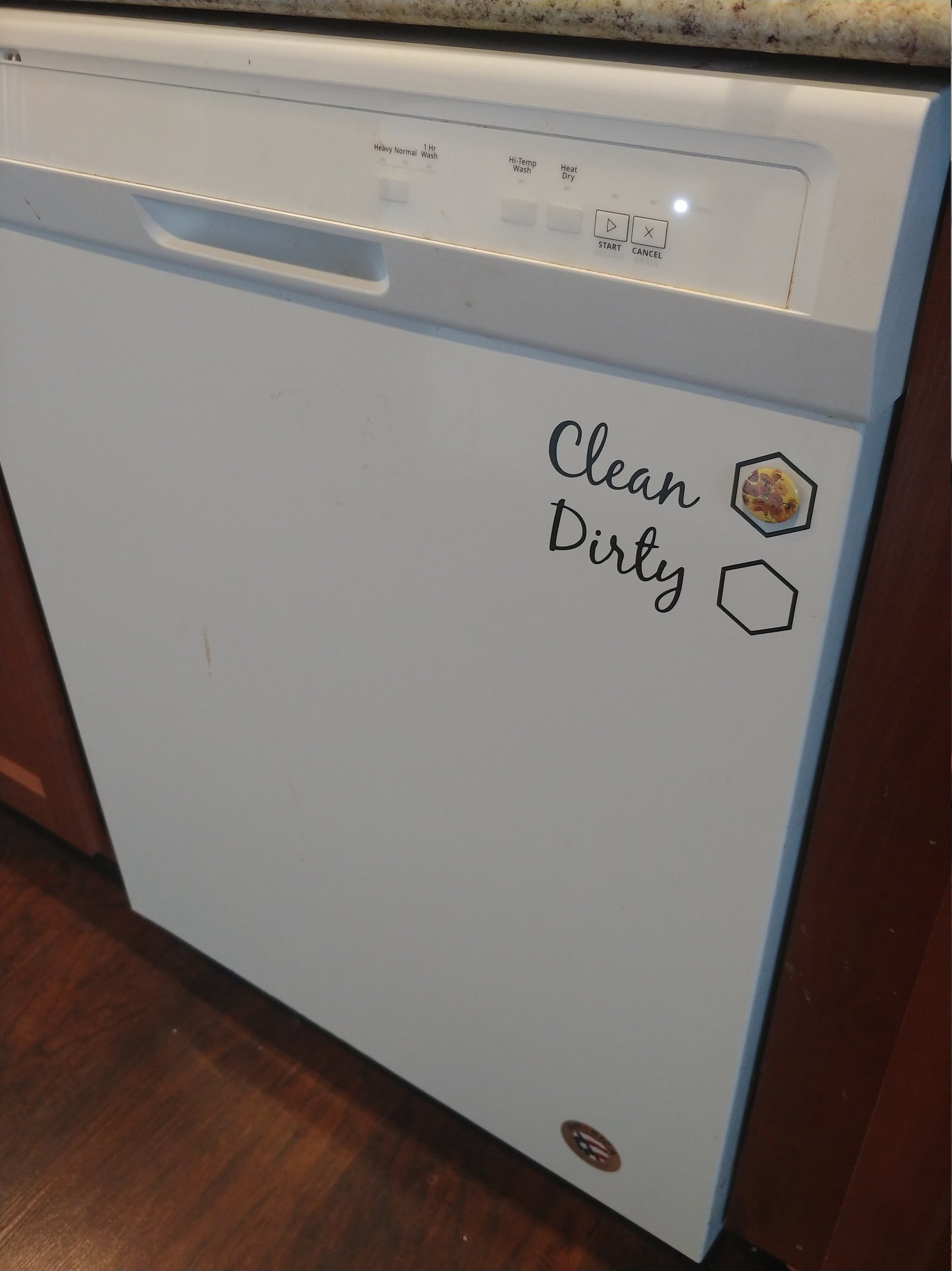 The InkBird Print Studio LLC Clean/Dirty Dishwasher Vinyl Cut Decal, designed in white, serves as a practical yet stylish magnetic indicator for your dishwasher. It acts as a subtle chore reminder that complements wood floors and brown cabinets when the "Clean" side is displayed.