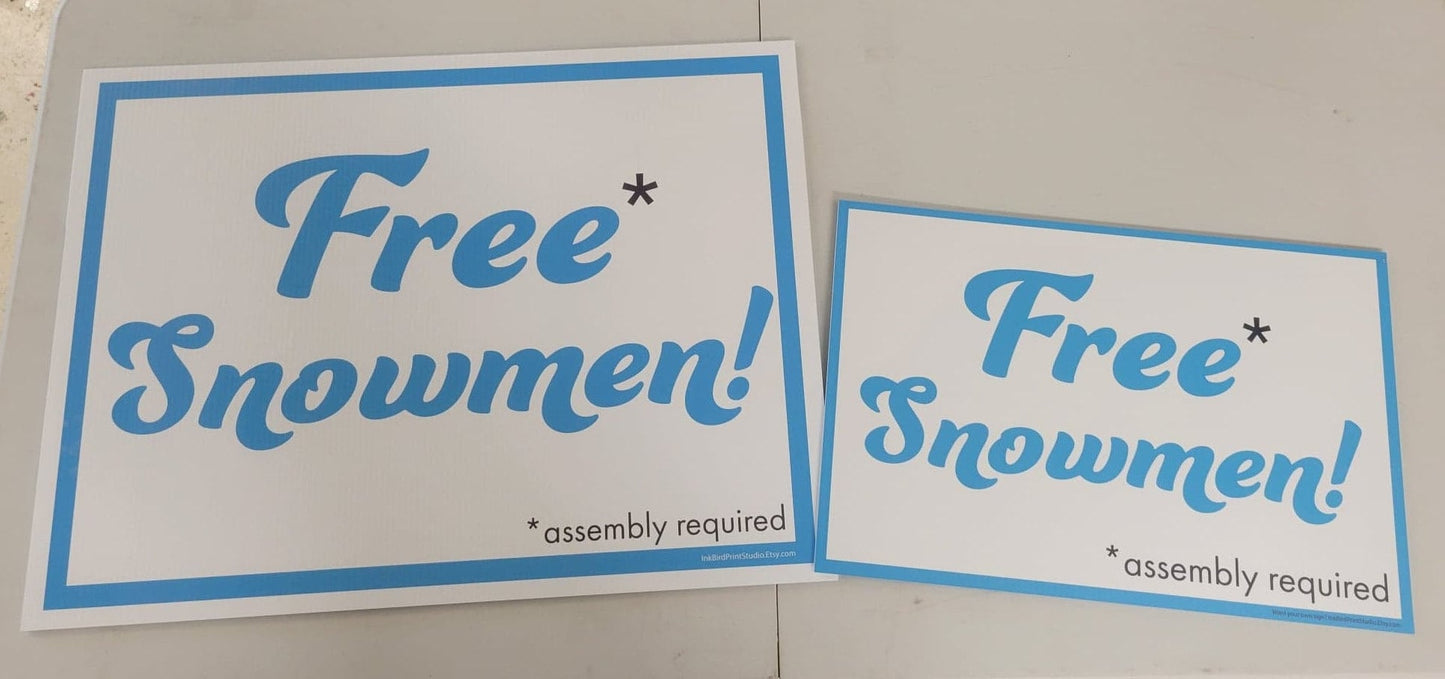 Two yard signs from InkBird Print Studio LLC display "Free Snowmen!" in large blue text on both sides, complemented by a small black note stating '*assembly required.' The blue-bordered design brings a festive charm reminiscent of holiday yard decorations. Available in sizes 12"x18" or 18"x24", these signs are ideal for grabbing attention during bulk pricing promotions, with more sizes available by request.