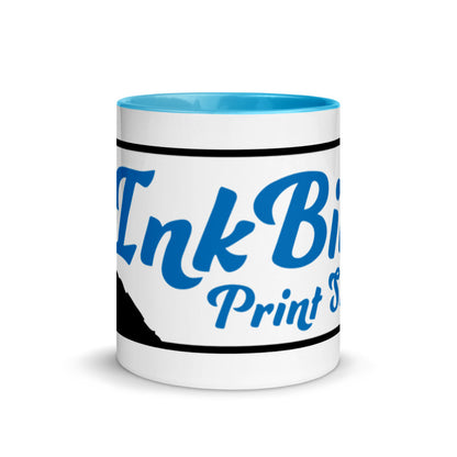 The InkBird Print Studio Logo Mug with Color Inside by InkBird Print Studio LLC is a white ceramic mug featuring an elegant blue and black cursive logo on a sky blue interior. This simple yet professional design is dishwasher safe, ensuring easy cleaning.