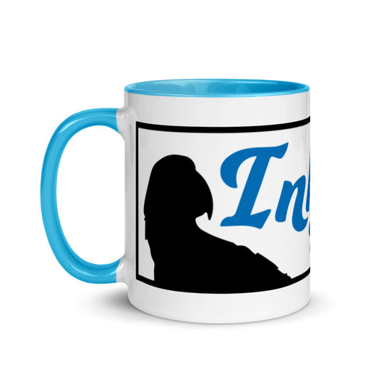 Introducing the InkBird Print Studio Logo Mug with Color Inside by InkBird Print Studio LLC, a delightful ceramic mug in white and blue featuring the word "Inigo" in elegant blue cursive. This stylish mug showcases a black silhouette of a figure wearing a hat against a vibrant backdrop. It's also dishwasher safe, ensuring effortless cleaning.